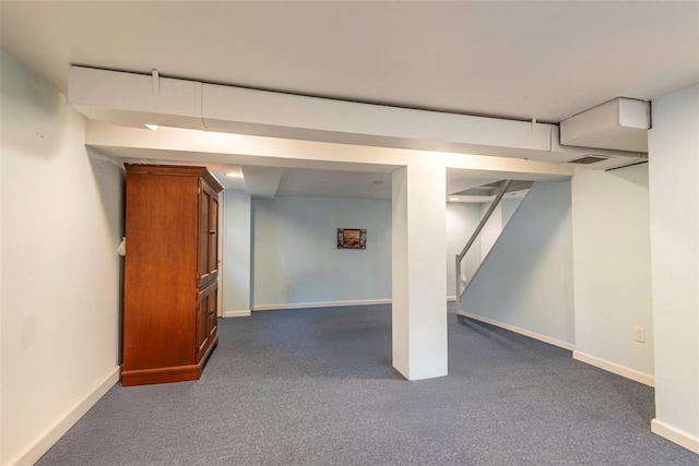103 Woods Ave, Malverne, NY 11565 - finished below grade area with dark carpet, baseboards, and stairs