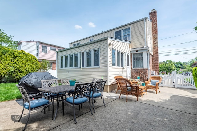 103 Woods Ave, Malverne, NY 11565 - view of patio with a gate and outdoor dining space