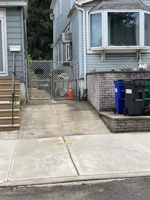 65-32 80th Ave, Glendale, NY 11385 - view of property exterior with a gate