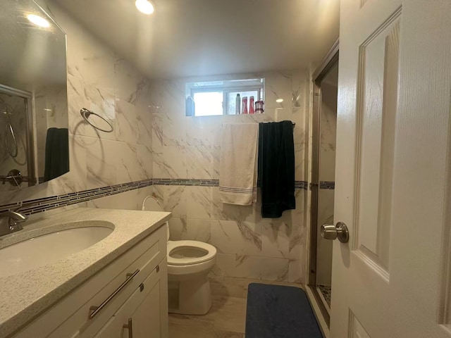 58-36 Bell Blvd, Bayside, NY 11364 - bathroom with a stall shower, vanity, tile walls, and toilet