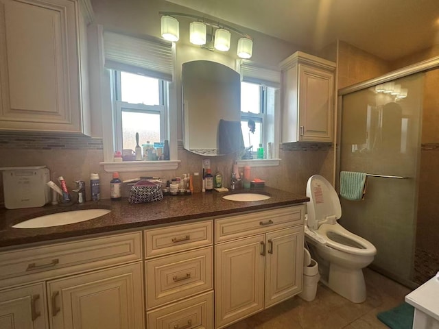 58-36 Bell Blvd, Bayside, NY 11364 - full bathroom with plenty of natural light, a shower stall, double vanity, and tile patterned floors