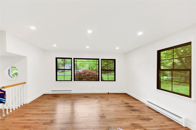 64 Lincoln Rd, Putnam Valley, NY 10579 - empty room featuring a baseboard heating unit, light wood-type flooring, recessed lighting, and baseboards