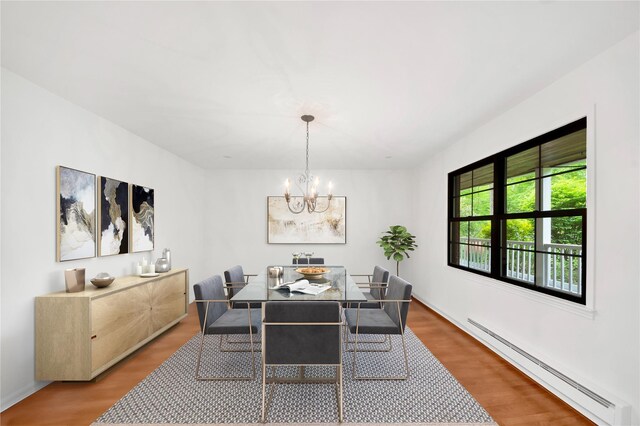 64 Lincoln Rd, Putnam Valley, NY 10579 - dining room featuring baseboard heating, a chandelier, and wood finished floors