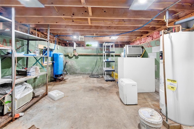 64 Lincoln Rd, Putnam Valley, NY 10579 - unfinished below grade area featuring electric water heater, a water pressure tank, and a wall mounted air conditioner