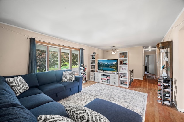 8 Ridge Rd, Wheatley Heights, NY 11798 - living area with wood finished floors and ceiling fan