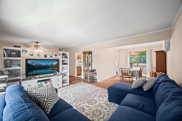 8 Ridge Rd, Wheatley Heights, NY 11798 - living room featuring a chandelier, wood finished floors, ceiling fan, a wall mounted AC, and baseboards