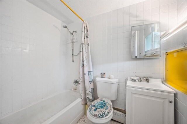 8 Ridge Rd, Wheatley Heights, NY 11798 - full bathroom featuring tile walls, a baseboard heating unit, vanity, shower / tub combo with curtain, and toilet
