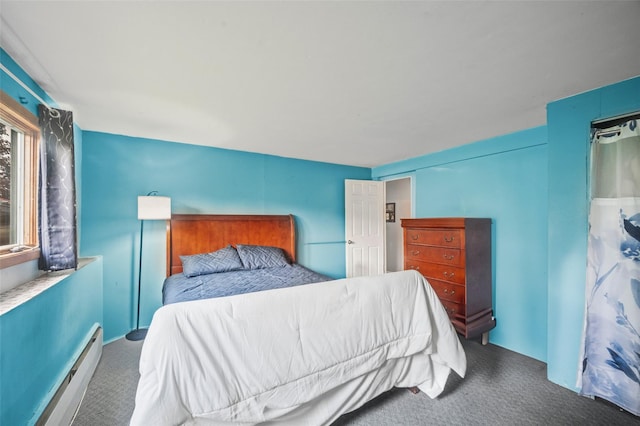 8 Ridge Rd, Wheatley Heights, NY 11798 - bedroom with carpet and a baseboard heating unit