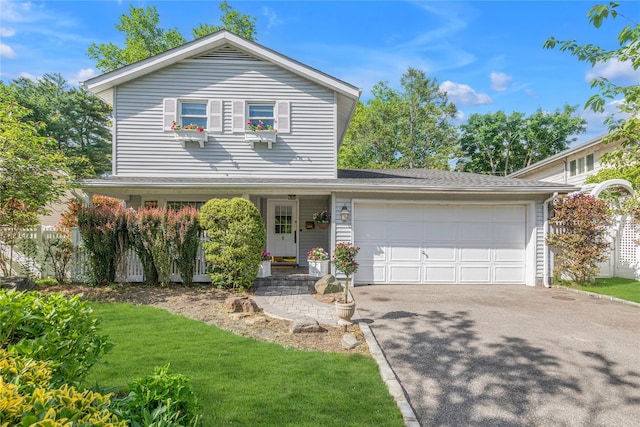 5 Seaview Ln, Port Washington, NY 11050 - traditional home with asphalt driveway and a garage
