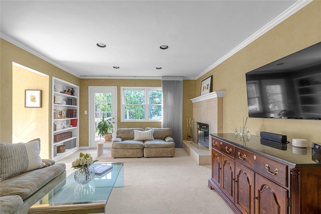 5 Seaview Ln, Port Washington, NY 11050 - living room with light colored carpet, ornamental molding, built in features, a glass covered fireplace, and recessed lighting