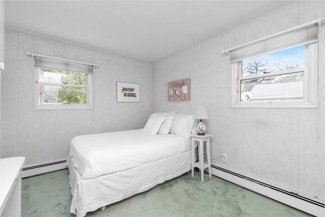 5 Seaview Ln, Port Washington, NY 11050 - carpeted bedroom with a baseboard heating unit