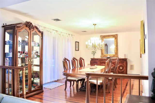 2 Greenwood Ct, Briarcliff Manor, NY 10510 - dining room featuring a chandelier and wood finished floors