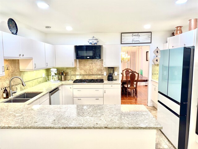 2 Greenwood Ct, Briarcliff Manor, NY 10510 - kitchen with freestanding refrigerator, black microwave, a sink, gas cooktop, and recessed lighting