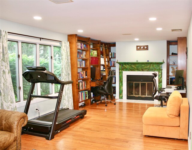 2 Greenwood Ct, Briarcliff Manor, NY 10510 - workout area with wood finished floors, a premium fireplace, and recessed lighting