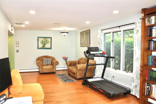 2 Greenwood Ct, Briarcliff Manor, NY 10510 - exercise room featuring a baseboard radiator, light wood-type flooring, and recessed lighting