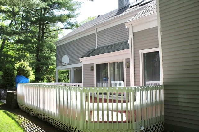 2 Greenwood Ct, Briarcliff Manor, NY 10510 - back of house featuring roof with shingles and a deck