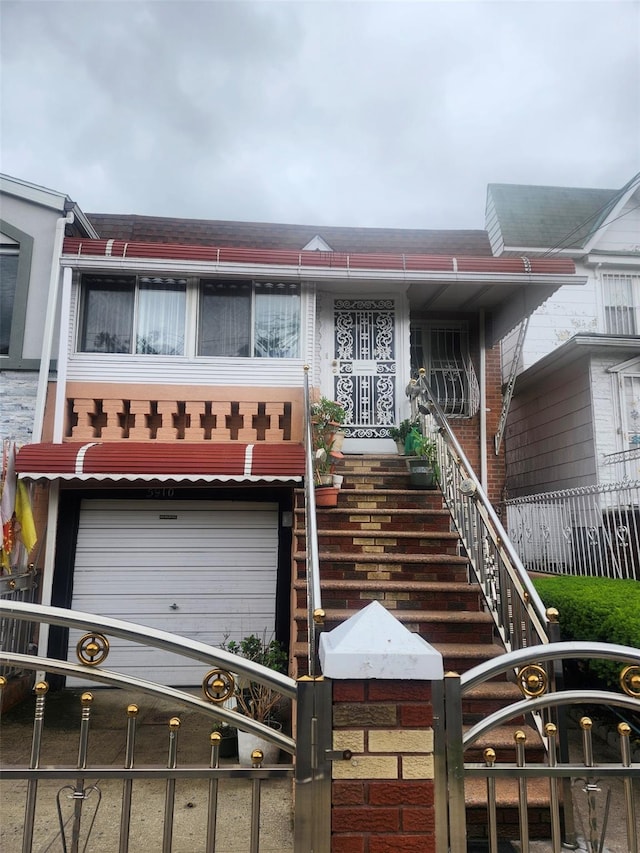 5910 Beverley Rd, Brooklyn, NY 11203 - view of front of property with an attached garage and stairway