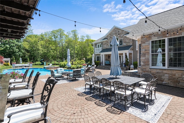 11 Crick Holly Ln, East Islip, NY 11730 - view of patio featuring an outdoor pool and outdoor dining space