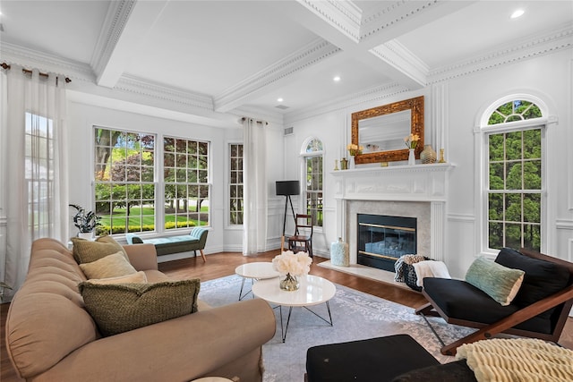11 Crick Holly Ln, East Islip, NY 11730 - living room with wood finished floors, ornamental molding, plenty of natural light, beam ceiling, and a fireplace