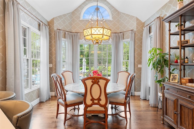 11 Crick Holly Ln, East Islip, NY 11730 - dining room featuring a chandelier, lofted ceiling, baseboards, healthy amount of natural light, and wallpapered walls