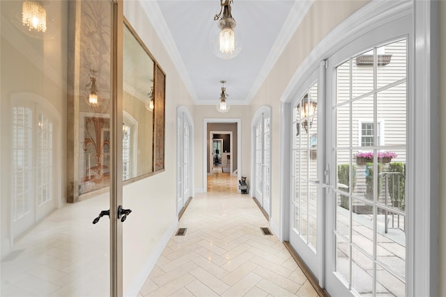11 Crick Holly Ln, East Islip, NY 11730 - corridor with french doors, baseboards, ornamental molding, and a chandelier