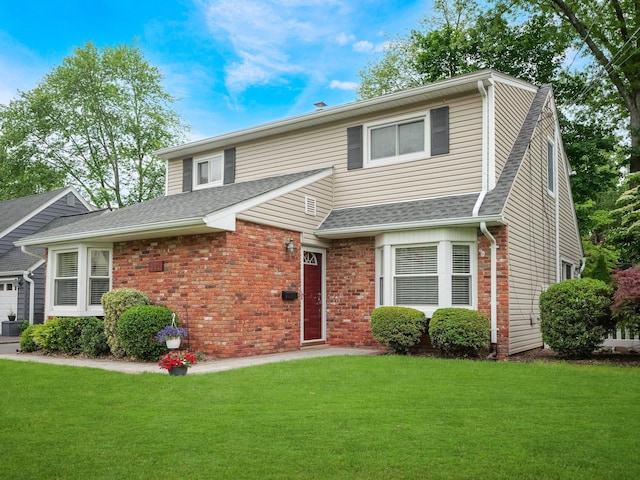 121 Bogert Ave, Pearl River, NY 10965 - traditional-style home with a front yard, roof with shingles, and brick siding