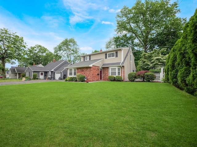 121 Bogert Ave, Pearl River, NY 10965 - view of front of house featuring asphalt driveway, a garage, and a front yard