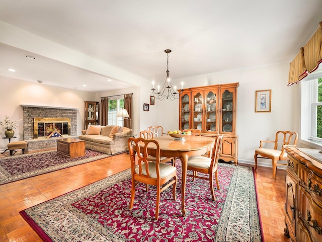 121 Bogert Ave, Pearl River, NY 10965 - dining space featuring a chandelier, a fireplace, recessed lighting, and baseboards