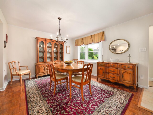121 Bogert Ave, Pearl River, NY 10965 - dining area featuring a chandelier, baseboards, and crown molding