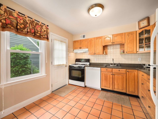 121 Bogert Ave, Pearl River, NY 10965 - kitchen with dishwasher, gas stove, under cabinet range hood, dark countertops, and a sink