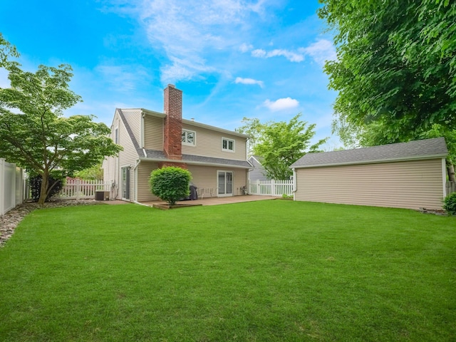 121 Bogert Ave, Pearl River, NY 10965 - rear view of house with a chimney, a patio area, and cooling unit