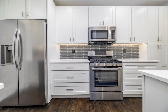 70 S Park Ave Unit 114, Rockville Centre, NY 11570 - kitchen with appliances with stainless steel finishes, light countertops, and white cabinets