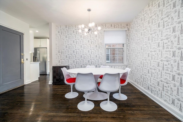 70 S Park Ave Unit 114, Rockville Centre, NY 11570 - dining space featuring wallpapered walls, a chandelier, dark wood finished floors, and baseboards