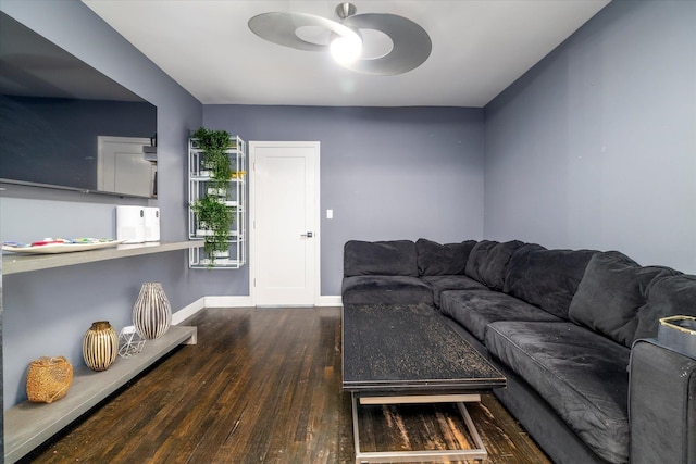 70 S Park Ave Unit 114, Rockville Centre, NY 11570 - living area featuring wood finished floors, ceiling fan, and baseboards