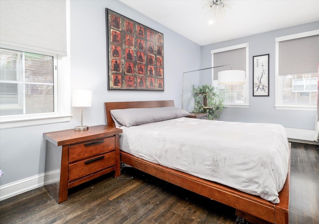 70 S Park Ave Unit 114, Rockville Centre, NY 11570 - bedroom with dark wood-type flooring and baseboards