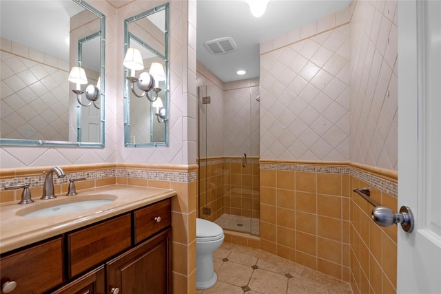 2 Driftwood Dr, Port Washington, NY 11050 - full bath featuring tile walls, tile patterned flooring, a stall shower, toilet, and vanity