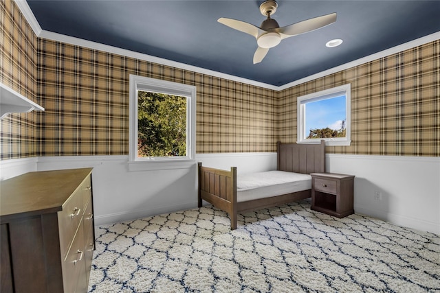 2 Driftwood Dr, Port Washington, NY 11050 - bedroom with wallpapered walls, a wainscoted wall, baseboards, a ceiling fan, and carpet flooring