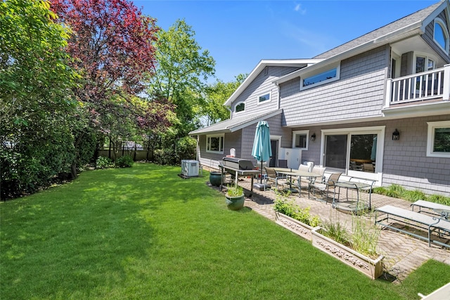 2 Driftwood Dr, Port Washington, NY 11050 - view of green lawn with a patio, a balcony, and cooling unit
