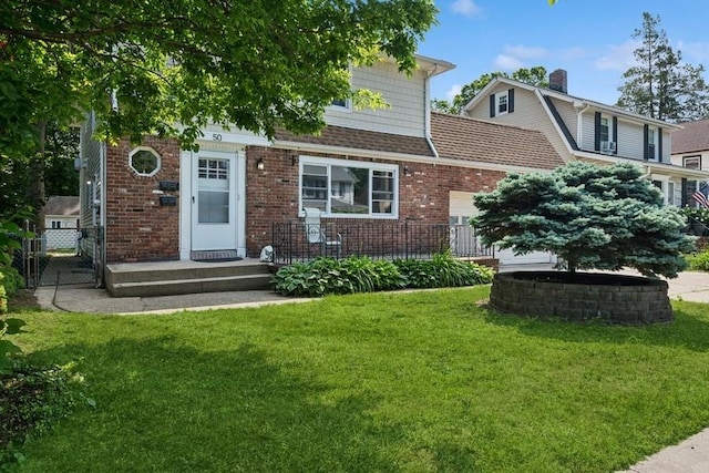 50 Christabel St, Lynbrook, NY 11563 - view of front of home featuring brick siding and a garage