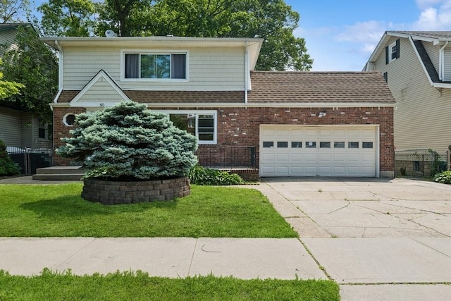 50 Christabel St, Lynbrook, NY 11563 - view of front of home featuring driveway, brick siding, and a garage
