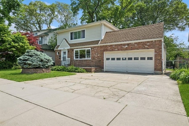 50 Christabel St, Lynbrook, NY 11563 - traditional-style home with an attached garage, driveway, and brick siding