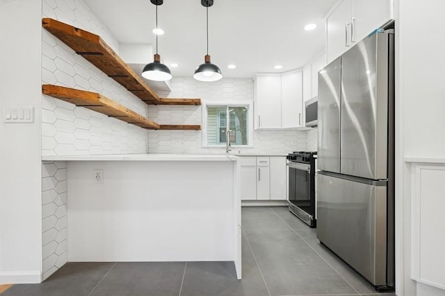 50 Christabel St, Lynbrook, NY 11563 - kitchen with stainless steel appliances, open shelves, white cabinets, recessed lighting, and a peninsula