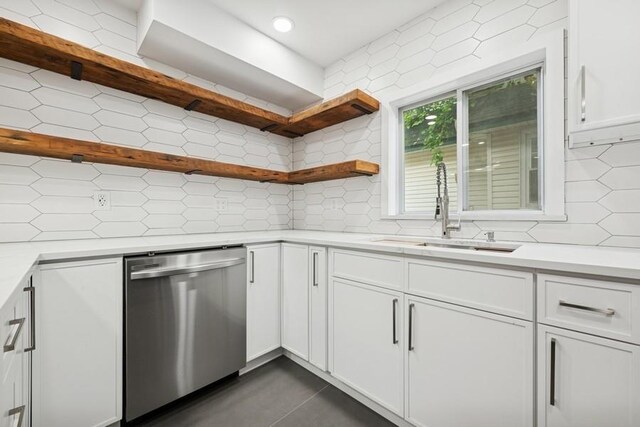 50 Christabel St, Lynbrook, NY 11563 - kitchen with dishwasher, decorative backsplash, open shelves, white cabinets, and light countertops
