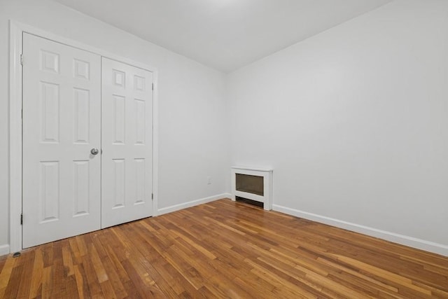 50 Christabel St, Lynbrook, NY 11563 - unfurnished bedroom with wood finished floors and a closet