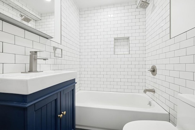 50 Christabel St, Lynbrook, NY 11563 - bathroom with tile walls, vanity, and shower / bathtub combination