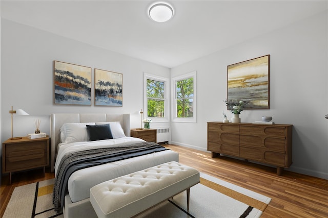 50 Christabel St, Lynbrook, NY 11563 - bedroom featuring radiator and wood finished floors