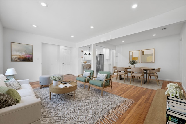 50 Christabel St, Lynbrook, NY 11563 - living room featuring recessed lighting and light wood-type flooring