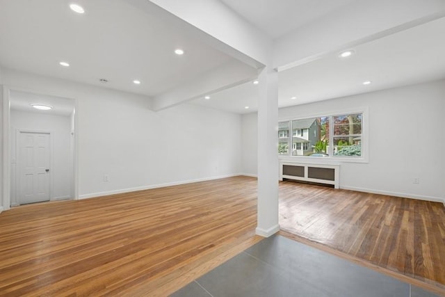 50 Christabel St, Lynbrook, NY 11563 - unfurnished living room featuring recessed lighting, wood finished floors, and beamed ceiling