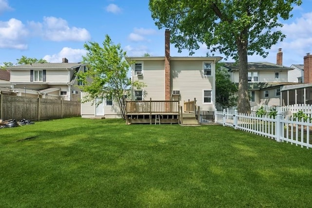 50 Christabel St, Lynbrook, NY 11563 - back of house featuring a wooden deck and a fenced backyard
