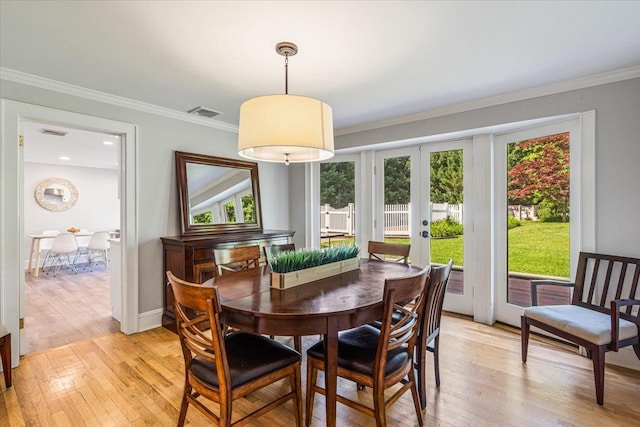 130 Sands Point Rd, Sands Point, NY 11050 - dining area featuring french doors, plenty of natural light, light wood-type flooring, and ornamental molding